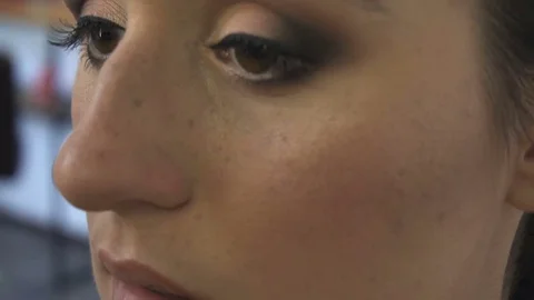 Professional make-up artist making face makeup art. Make up and fashion concept Stock Footage 79063374