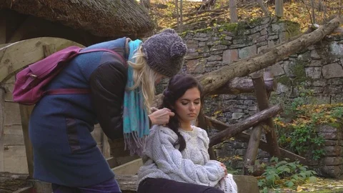 A professional make-up artist prepares a model for photography. paints a woman Stock Footage 82332585