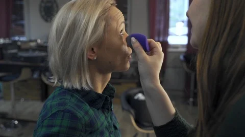 Professional make-up artist at work brush hand closeup - beauty fashion industry 스톡 동영상 100943848