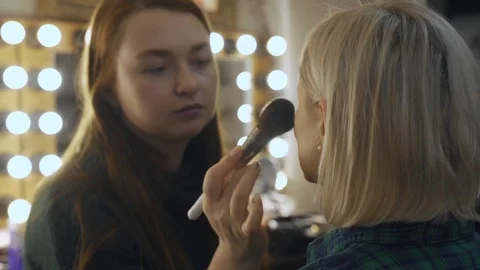 Professional make-up artist at work brush hand closeup - beauty fashion industry 库存影片 101021742