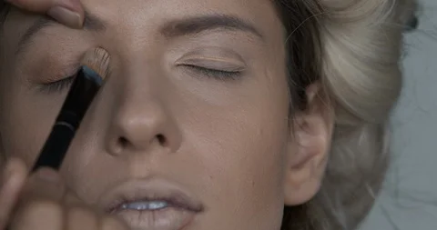 Professional make-up artist at work Stock Footage 124763633