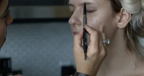 Professional make-up artist at work Stock Footage 125963619