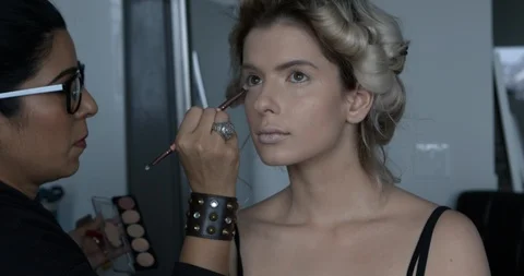 Professional make-up artist at work Stock Footage 125963660