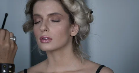 Professional make-up artist at work Stock Footage 125963699