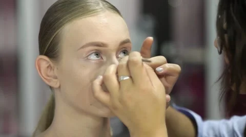 Professional make up artist working on a model Stock Footage 67319240