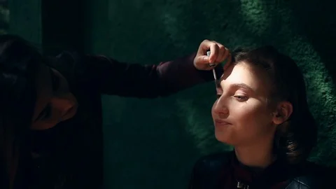 Professional make up artist working on a model . Retro make-up Stock Footage 75265002