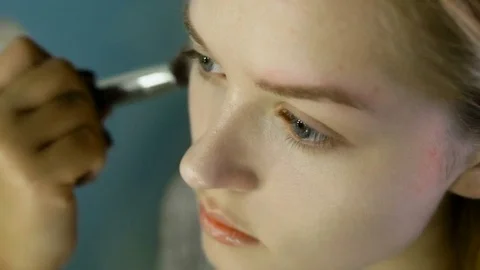 Professional make up artist working on a model 스톡 동영상 82075030