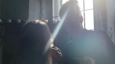 Professional make-up artist working in studio applying make-up to a models face Stock Footage 52265640