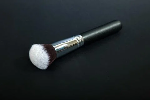 Professional make-up brush on black background, natural cloth, m Stock Photos