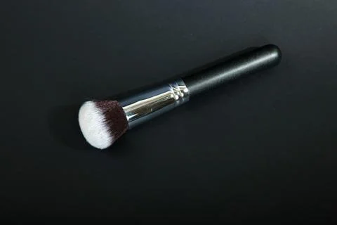 Professional make-up brush on black background, natural cloth, m Stock Photos