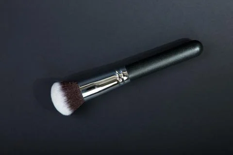 Professional make-up brush on black background, natural cloth, m Stock Photos