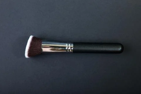 Professional make-up brush on black background, natural cloth, m Stock Photos