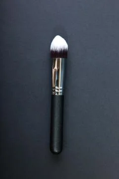 Professional make-up brush on black background, natural cloth, m Stock Photos