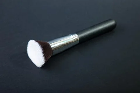 Professional make-up brush on black background, natural cloth, m Stock Photos