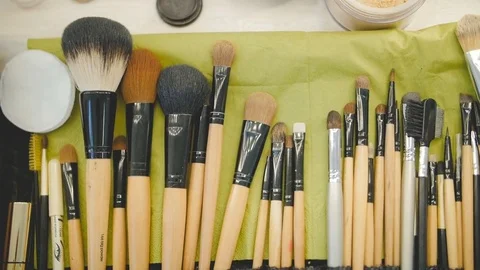 Professional make-up brushes set on the table. Top view Stock Footage
