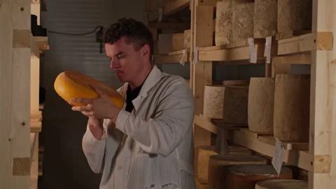 Professional make Cheese Maker Concentrated On Checking Ready Fresh cheese 库存影片 180018433