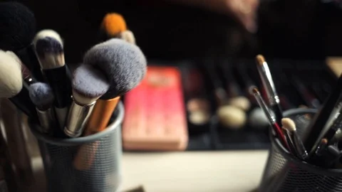 Professional make-up. Makeup artist doing makeup for an elderly woman. The old l Stock Footage 106379493