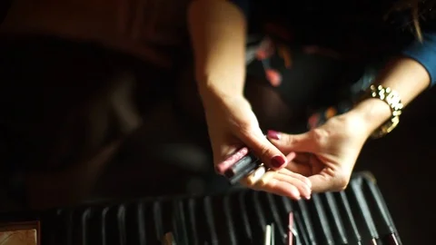 Professional make-up. Makeup artist doing makeup for an elderly woman. The old l Stock Footage 106383511