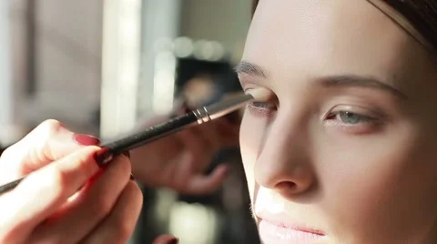 Professional make-up. Side view of eyeshadow application with brush. Close-up Stock Footage 54635920