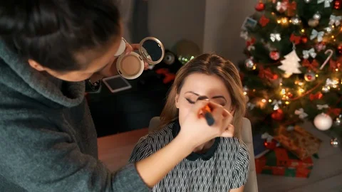 Professional makeup artist to do make up beautiful young model. New look in Stock Footage 118261675