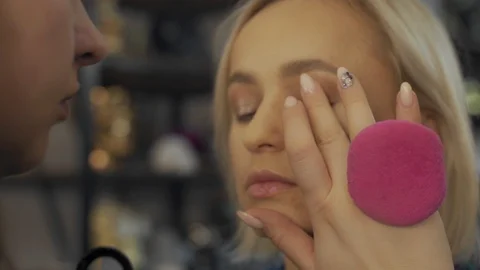 Professional makeup artist making eye-makeup for young model Stock-Footage 101022751