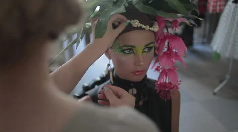 Professional makeup artist tints the model's eye,makeup, professional makeup, Stock Footage 46222747