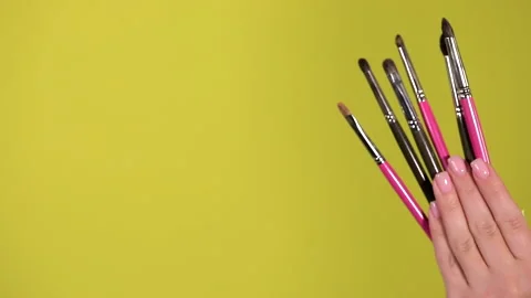 Professional makeup brush set, yellow background Stock Footage 231040332