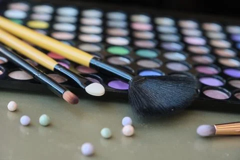 Professional makeup brushes and tools. Eyeshadow nude palettes. Stock Photos