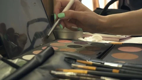 Professional makeup brushes in a leather bag. Using a make up palette with brush Video stock 79054685