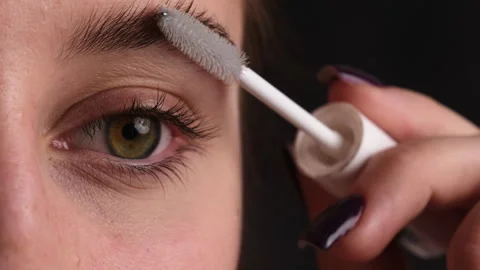 Professional Makeup Close Up Tutorial, Girl Brushing Eyebrows With Brush 動画素材 273495266