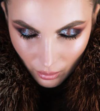 Professional makeup using highlighter and shiny eyeshadows. Stock-Fotos