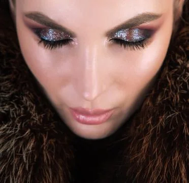 Professional makeup using highlighter and shiny eyeshadows. Stock Photos