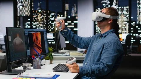 Professional male developer operating VR glasses to create spaceship station Stock Photos