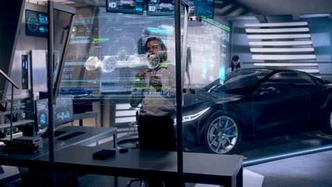 Professional Male Engineer interacts with Black Hologram Car concept Stock-Footage 120867969