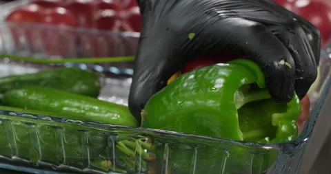 Professional male preparing dish, taking green bell pepper. Colorful vegetables Stock Footage 286832826