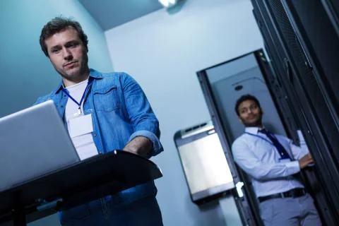 Professional male programmer working on the computer Stock Photos