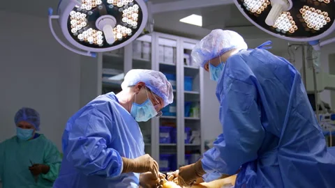 Professional male surgeons perform operation on foot. Trauma operation progress Stock Footage 342572671