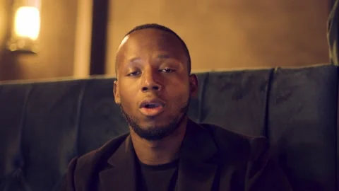 Professional male talking to camera assertively using hand gestures on video Stock Footage 144194789