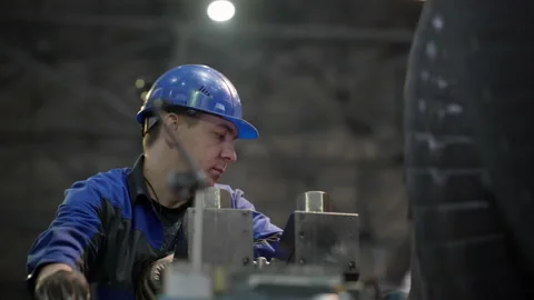 Professional Male Technical Worker Controls Quality Of Rotating Turbine Engine Video stock 171967889