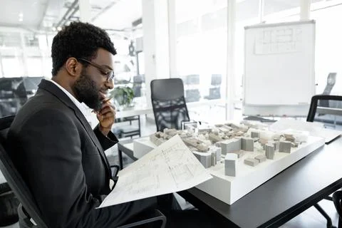 Professional man architect solving engineering problems in his workplace Foto stock