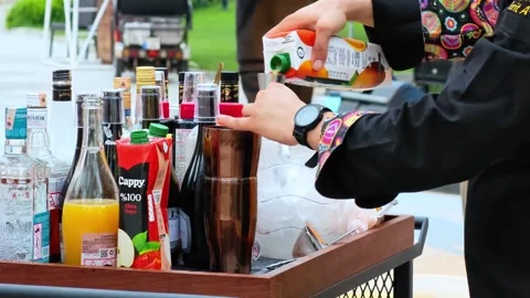 Professional man bartender shaking cocktail drink in cocktail shaker. Stock Footage 312915891