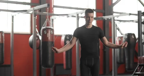 Professional man boxer is jumping rope making cardio training in gym. Stock Footage 127101910
