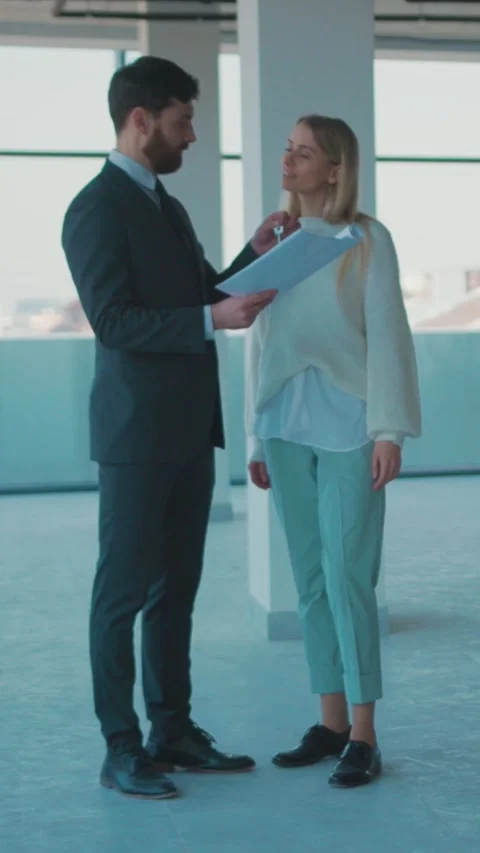 A Professional Man Dressed in a Suit is Standing Confidently Near a Wall in a Stock Footage 314172253