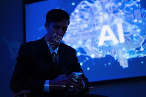 Professional man engaged with phone while sitting in front of AI presentati.. Stock Photos