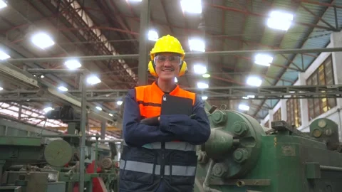 Professional man engineer wearing safety helmet in factory warehouse. Vidéo 332119434
