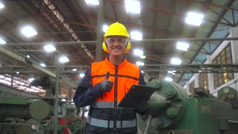 Professional man engineer wearing safety helmet in factory warehouse. Stockbeeldmateriaal 332119438