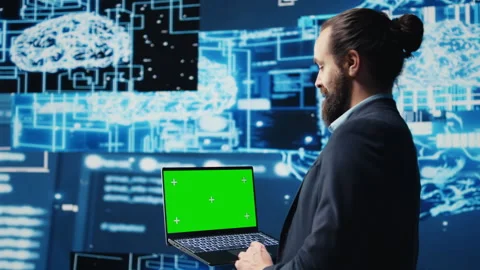 Professional man ensures artificial intelligence algorithms with mockup screen Stockbeeldmateriaal 310972431