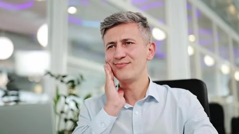 Professional Man Experiences Sudden Toothache or Jaw Pain Working in Office Stock-Footage 312370488
