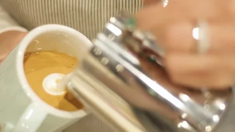 Professional man hand pouring stream milk for making espresso latte art. Stock-Footage 334648518