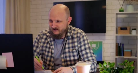 Professional man handling work and personal calls, multitasking evident in Stock Footage 301522805